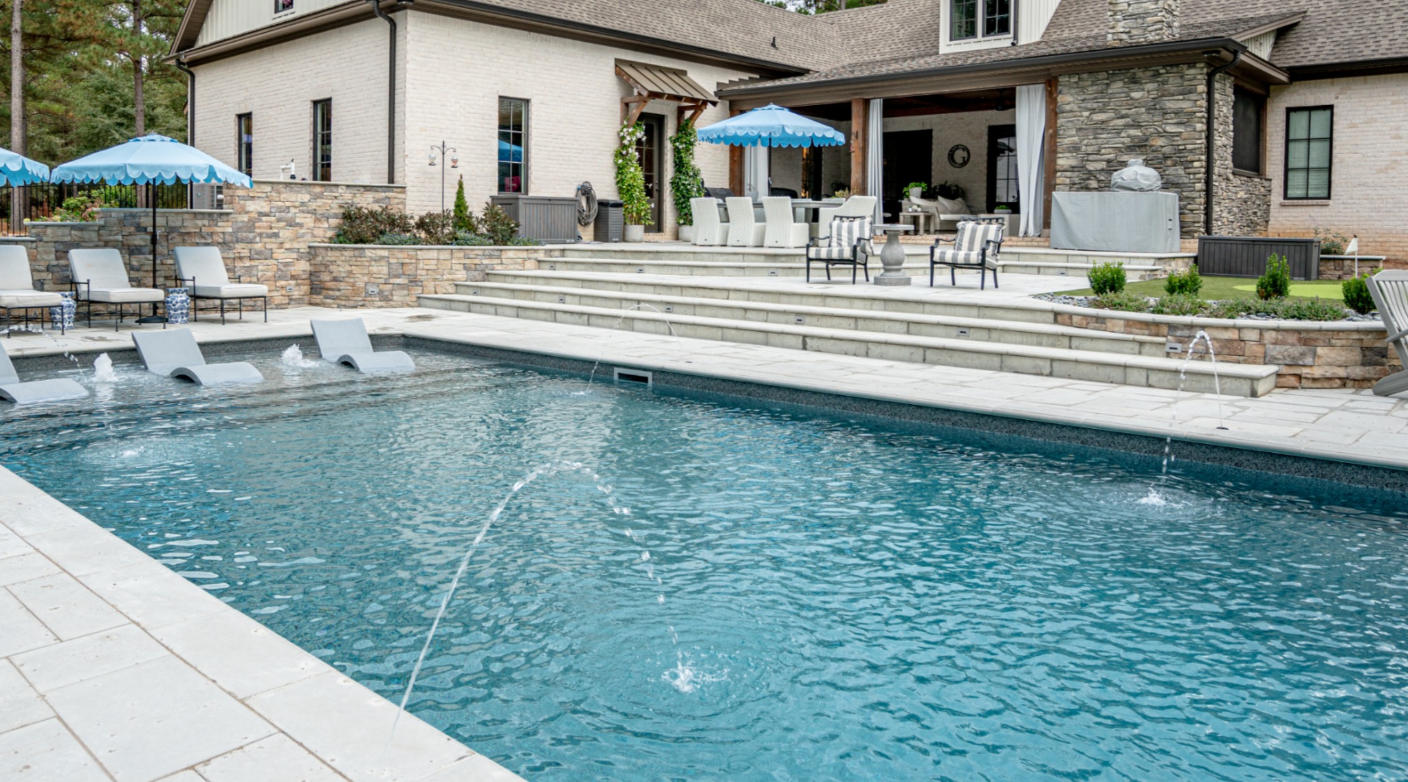 Luxury backyard swimming pool and outdoor living design